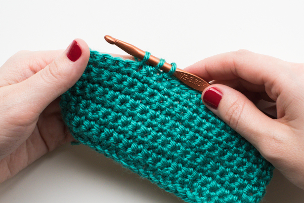 Insert hook into next stitch and draw up a loop. Three loops will now be on your hook.